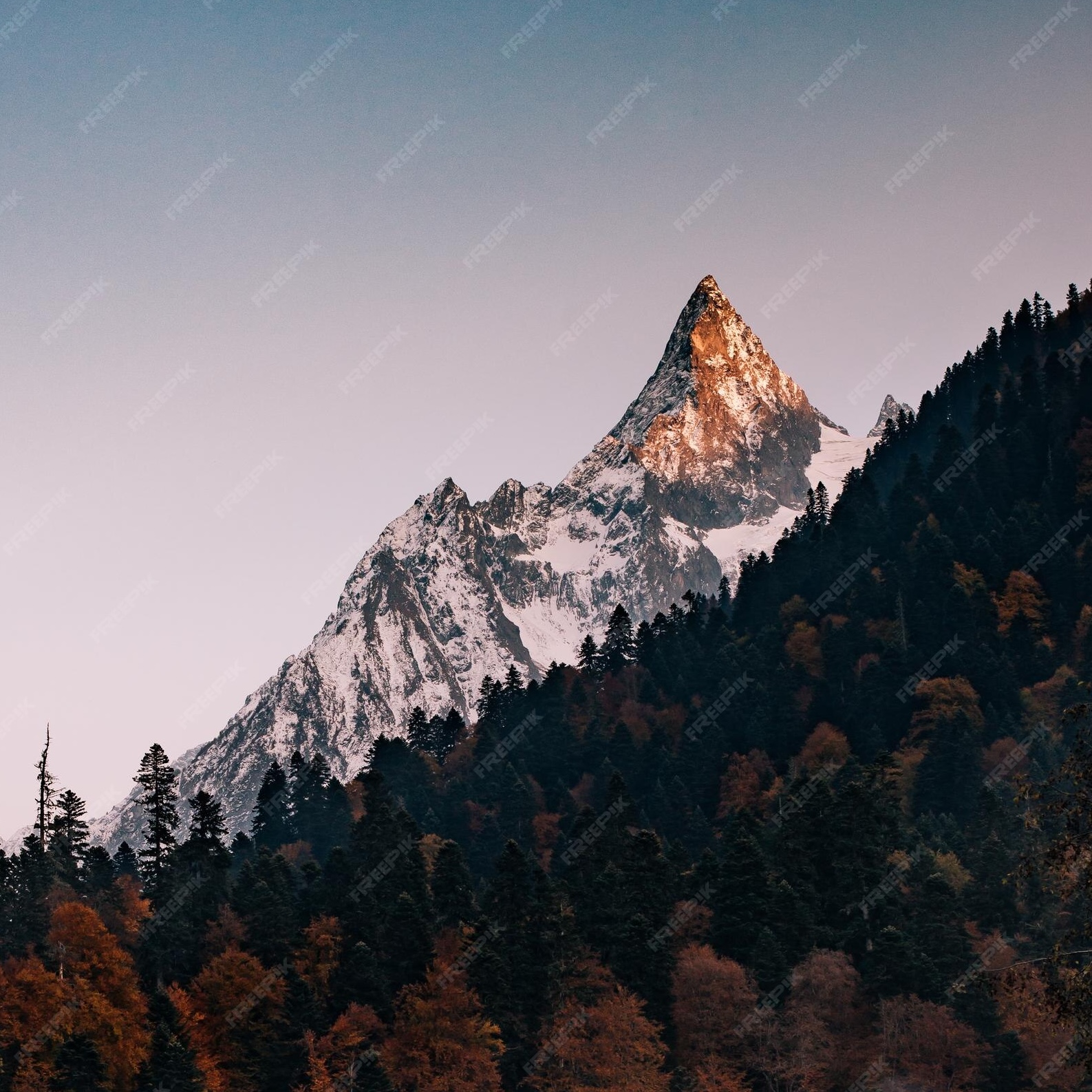 scenic-view-snowcapped-mountains-against-clear-sky_1048944-26232846